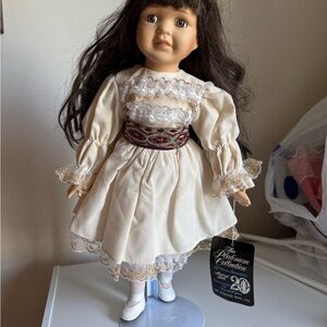 Vintage Elegant Porcelain Doll in Cream Dress